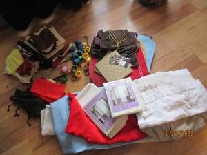Assortment of table and window coverings along with place settings and other misc