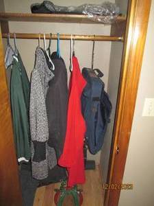 Content of entry closet to include womens outerwear (Mostly 2224w and 2XL tall, misc floor coverings and other Misc