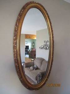 44 Oblong decoratively framed wall mirror