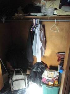 Content of spare bedroom closet including designer sunglasses and eyeglass frames, World Market Dish from Italy, womens clothing, fabrics, decorative boxes, pet travel bag, gift wrapping supplies, designer wallet and purses plus more