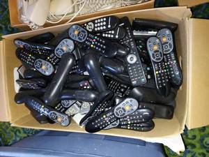 lot 100 image: Various TV remotes, phones, Amana Remotes