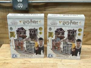 lot 62 image: HARRY POTTER Lot of 2- Cityscape 3D Paper Puzzles (Diagon Alley)