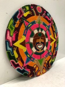 lot 108 image: Vintage Round Woven Sun Textile Artwork