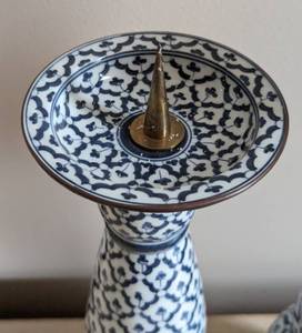 lot 80 image: Pair of Maitland Smith Blue and White Metal Pilar Candleholders