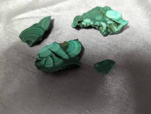 Polished malachite pieces with raw ...