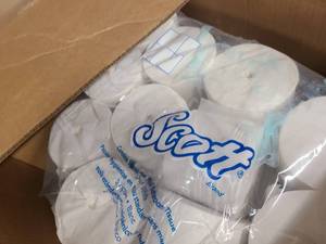 Box of Scott branded paper rolls
