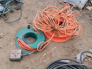 lot 717 image: Lot of (2) Extension Cords with Cord Reels