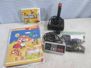 lot 13 image: (CS) Nintendo Super Mario Bros 2 3DS Game, World 2 Book, 2 Controllers and Atari Cables