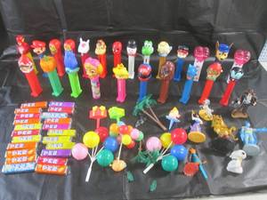 lot 24 image: (CS) Assorted Pez Dispensers, Candy and Cake Top Decor