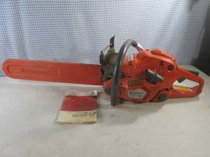 lot 75 image: (BR2) Husqvarna Auto Tune 555 Chain Saw with Bar Cover and Manual