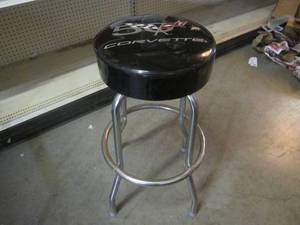 lot 92 image: (CS) Corvette 50th Anniversary Swivel Stool - Couple holes in seat. See Photos