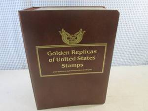 lot 216 image: (BS) Full Book of Golden Replicas of United States Stamps First Day Of Issue Proof Replicas On A Gleaming Surface of 22kt Gold