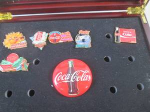 lot 220 image: (FS) Partial The Ultimate Coca-Cola Pin Collection in Wood Glass Top Display Case