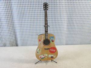 lot 250 image: (BS) Coca-Cola A Song and A Smile Guitar Collection Cant Beat The Feeling with Stand - Has 3 Broken Tuning Knobs