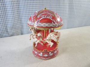 lot 332 image: (CSB) The Bradford Exchange Coca-Cola Musical Carousel Plays The Carousel Waltz (Needs Repair - Glue Base to Top)