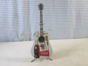 lot 341 image: (CS) Rocking Good Taste from the Coca-Cola A Song And A Smile Guitar Collection with Stand