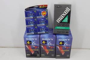 lot 34 image: New Unopened VHS Tapes & DVC Cartridges