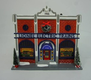 lot 73 image: Department 56 The Original Snow Village Collection Lionel Electric Train Shop 56.54947 Year 1998