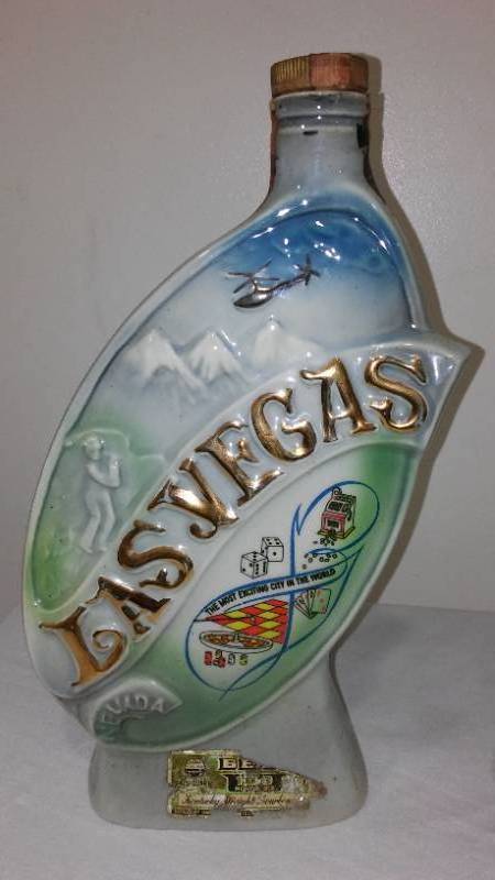 lot 519 image: Vintage Jim Beam Decanters (3) & Pottery.