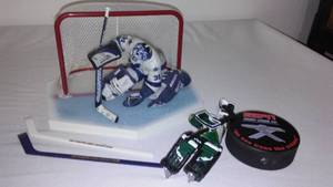 lot 12 image: Curtis Joseph Scale Figurine, Eddie Balfour figure,  starting lineup and more.