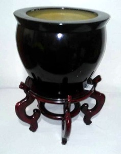 lot 89 image: Wood Ceramic Pot Holder With Pot.