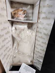 lot 71 image: The Ashton-Drake Galleries Porcelain Doll Titled Finishing Touch NIB with COA