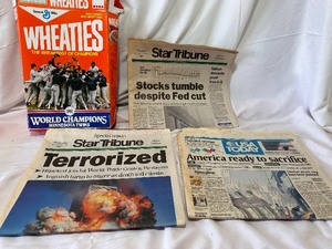 lot 163 image: Newspapers from September 12, 17, & 18, 2001 and Minnesota Twins World Champions Wheaties Box