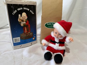 lot 162 image: Ann Geddes Doll Baby Santa in Box and Scrooge Cast Iron Door Stop