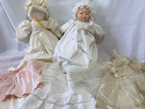 lot 130 image: Two Baby Dolls and Doll Wedding Dress and Pink Dress