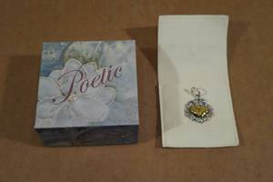 lot 67 image: Waxing Poetic Sterling Silver & Brass 2-Heart Necklace Charm