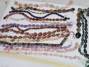 lot 19 image: Gemstone Bead Mix #5 Beads on a 16 inch string for jewelry making. Includes 16 strands of various Jasper, Agate, Jade, calcite, Aquamarine, Chrysocolla, Quartz, Opal, Amethyst and rose quartz.