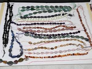 lot 22 image: Gemstone Bead Mix #8 Beads on a 16 inch string for jewelry making. Includes 26 strands of various - Jasper, Agate, Jade, calcite,, Chrysocolla, Quartz, Opal, Amethyst, Lapis and rose quartz.