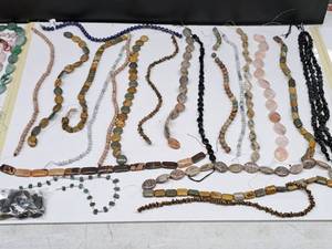 lot 27 image: Gemstone Bead Mix #13 Beads on a 16 inch string for jewelry making. Includes 19 strands of various Jasper, Agate, Jade, calcite, Quartz, Opal, Amethyst, Lapis and rose quartz.