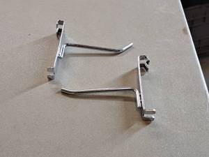 lot 392 image: Lot of (50) 4 Grid Wall Hooks
