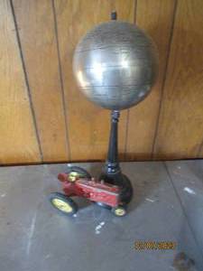 lot 39 image: Heavy Metal Globe with metal base and vintage Pro-Scale metal tractor