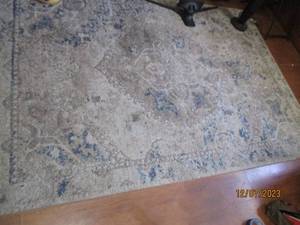 lot 41 image: 57 area rug in hues of blue, tan and cream