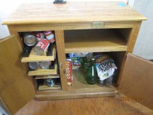 lot 58 image: Heavy Wood entertainment cabinet with canned goods