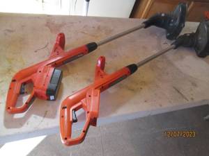 lot 4 image: Pair of battery operated Black and Decker weed whips
