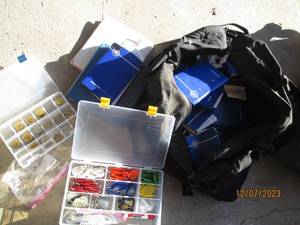 lot 64 image: Large Duffle bag loaded with NA reading materials, sobriety medallions, Keychains and more