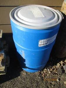 lot 69 image: Plastic 55-gallon covered drum