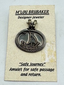 lot 82 image: M Lou Brubaker Sterling Silver Safe Journey Amulet  Pendant