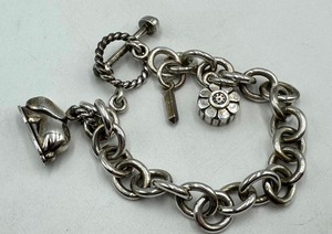 lot 84 image: Sterling Silver Gallen Benson Charm with Bracelet