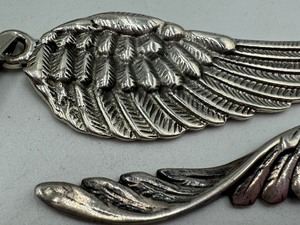 lot 138 image: Two Sterling Silver Winged Shaped Pendants