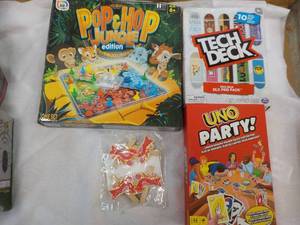 lot 335 image: Uno Party, Tech Deck, Pop and Hop Jungle and Clothes Pins