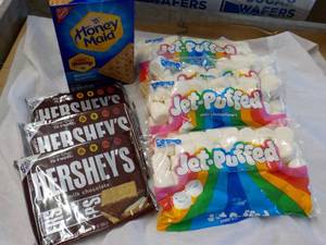 lot 139 image: 1 Box Honey Maid Graham Crackers, 4 bags Jet Puffed Marshmallows and 3 - 6 packs Full Size Candy Bars