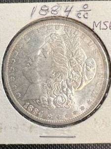 1884-OCC US MORGAN SILVER DOLLAR MS63