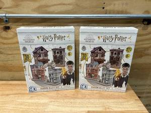 lot 34 image: HARRY POTTER Lot of 2- Cityscape 3D Paper Puzzles (Diagon Alley)