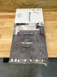 lot 29 image: LIFEPROOF Case of- Castle Black Slate 6 MIL x 12 in. W x 24 in. L Click Lock Waterproof Vinyl Tile Flooring (23.8 sq ft)