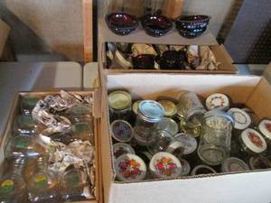 lot 104 image: Ruby Red Nova depression glassware assortment, glass creamer bottles and various size Canning jars
