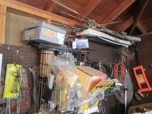 lot 108 image: Content of wall items consisting of various extension cords, misc tools and household supplies